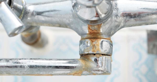 close up of faucet with limescale