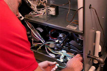 technician working on furnace